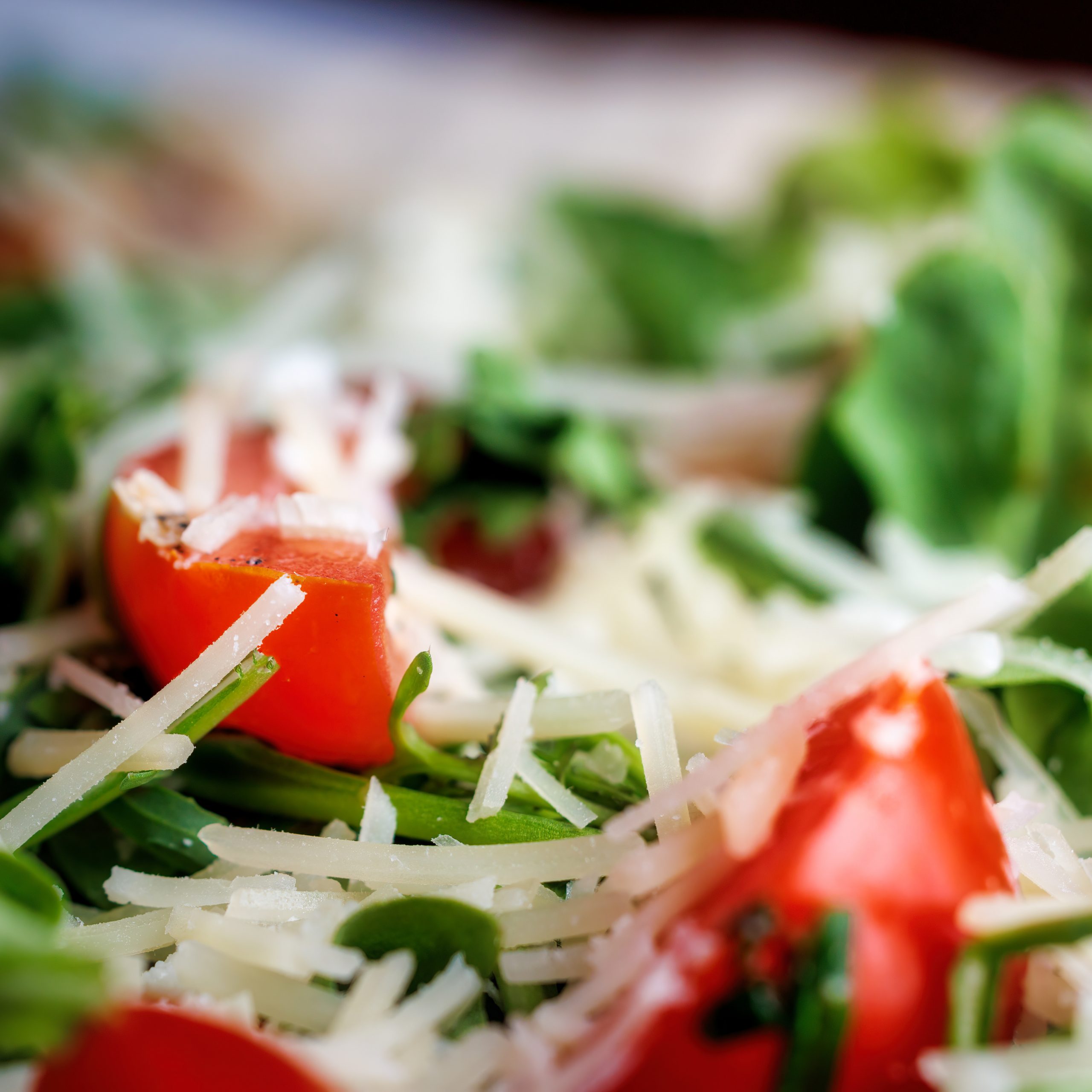close up of salad with cheese and tomatoes